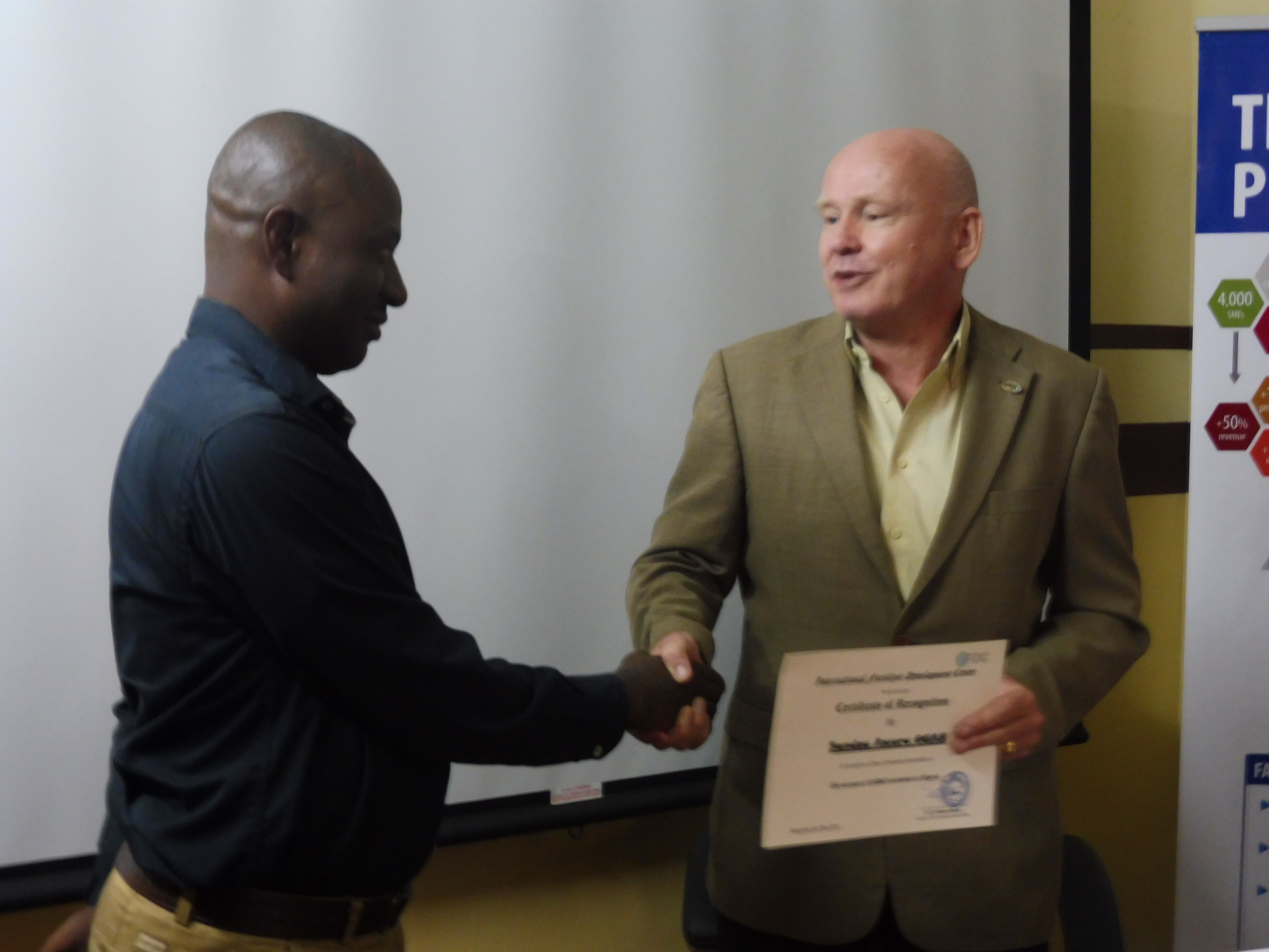 Awuru Sunday Ogah (left), Nigeria Office Assistant, and Rob Groot, Director of IFDC's North and West Africa Division