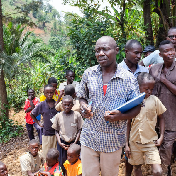 An instructor speaks to farmers in Benin.