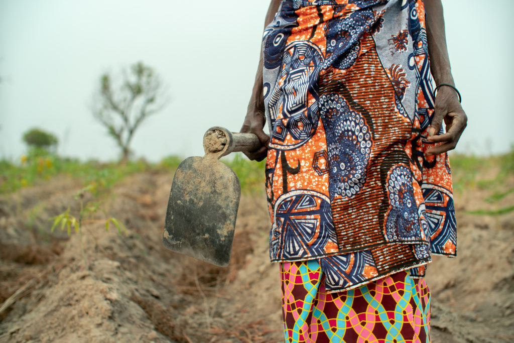 Local Female farmer dressed in colorful African cloths, Angola 2019