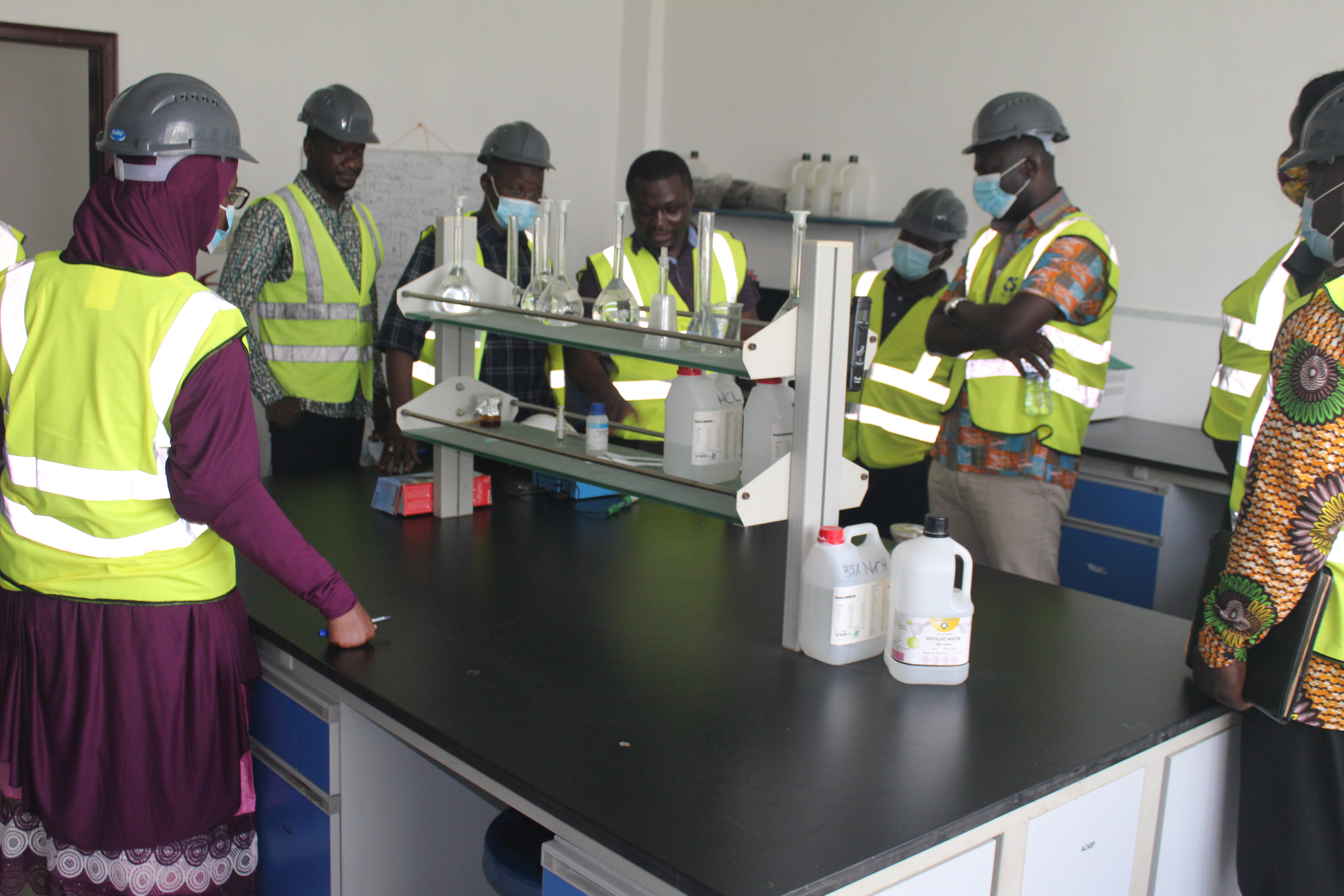 The Niger team in a discussion with officials of a laboratory at the Accra Compost and Recycling Plant during their learning tour to Ghana.