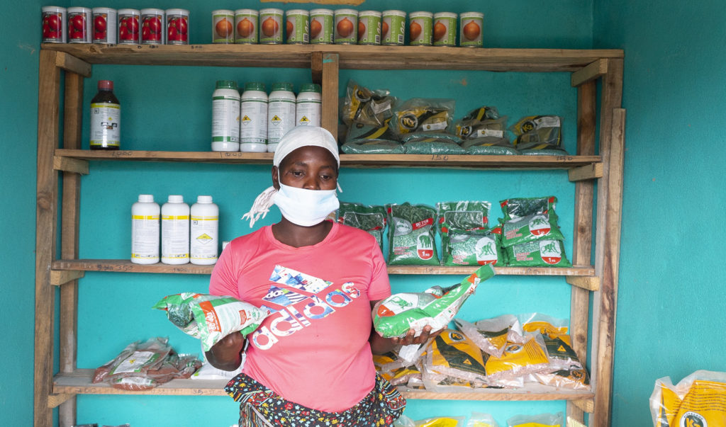Agro-dealer in Chinyambudzi showcases inputs available in her shop.