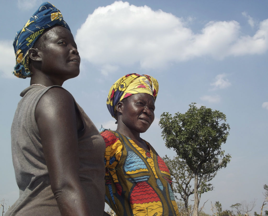Hard-working women from South Sudan look into the distance