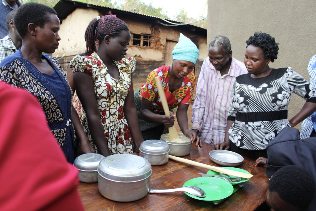 Community members participate in a cooking demonstration from the PNSP project