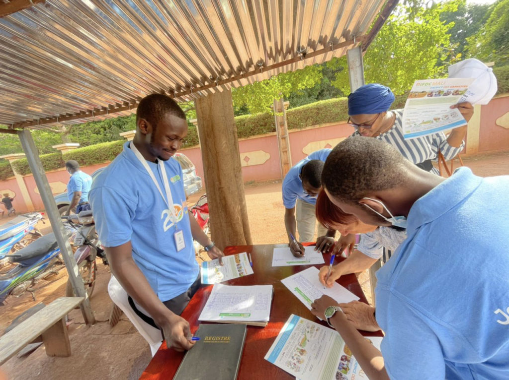 Event attendees sign in at the registration table