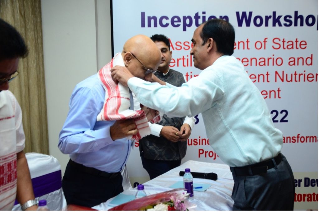 A guest is presented with honors during the inception workshop
