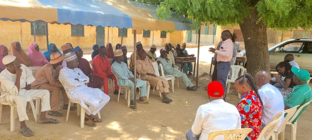 The Tegemeo delegation sits outside for a presentation