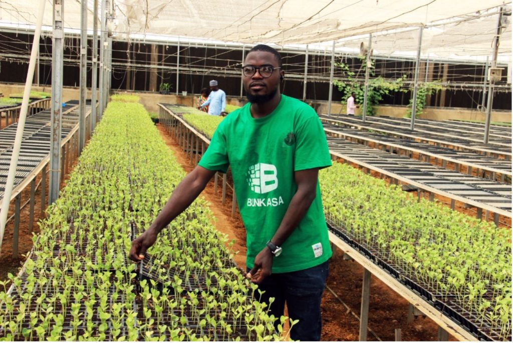 Muhammed shows his vegetable seeds in a nursery