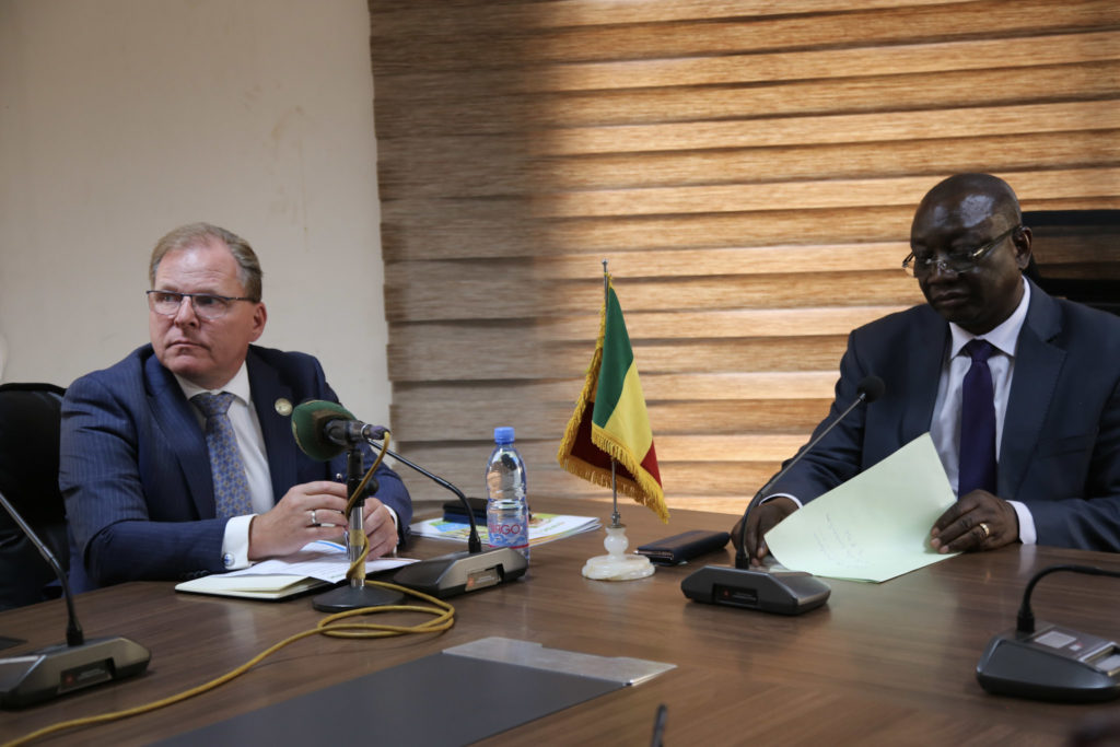 Henk (left) sits with the Malian Minister of Rural Development (right) during a framework agreement signing