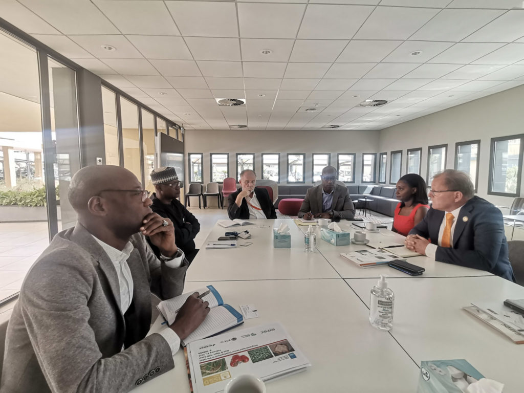 Henk sits with the team from the Dutch embassy in Mali