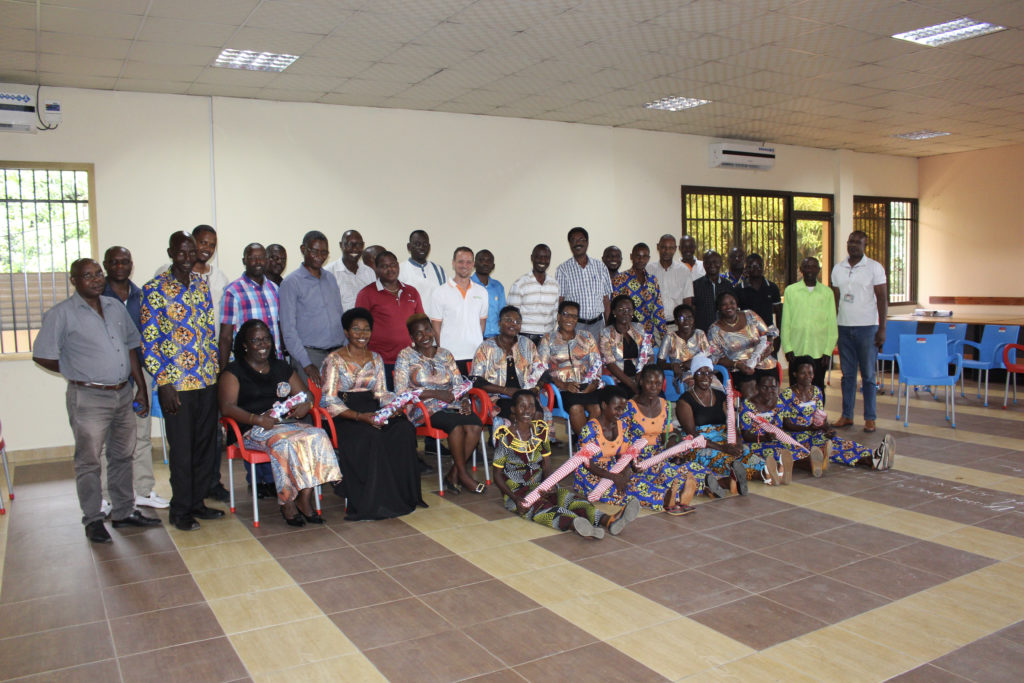 The IFDC Burundi team poses for a picture with project beneficiaries