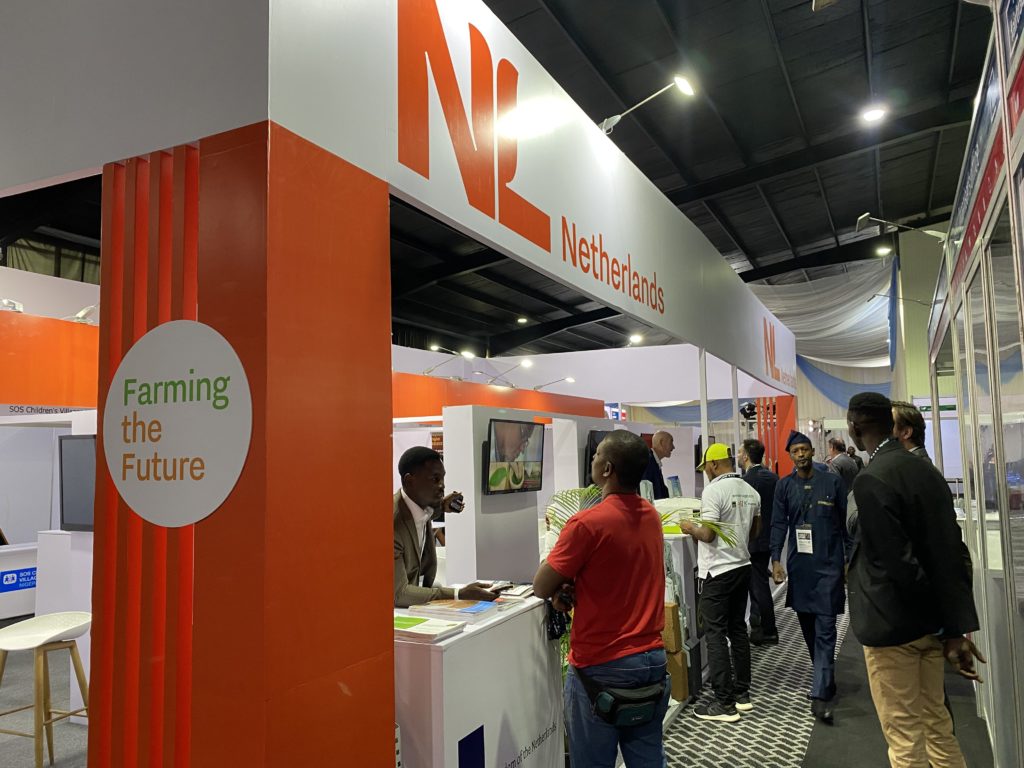 Attendees visit the netherlands booth