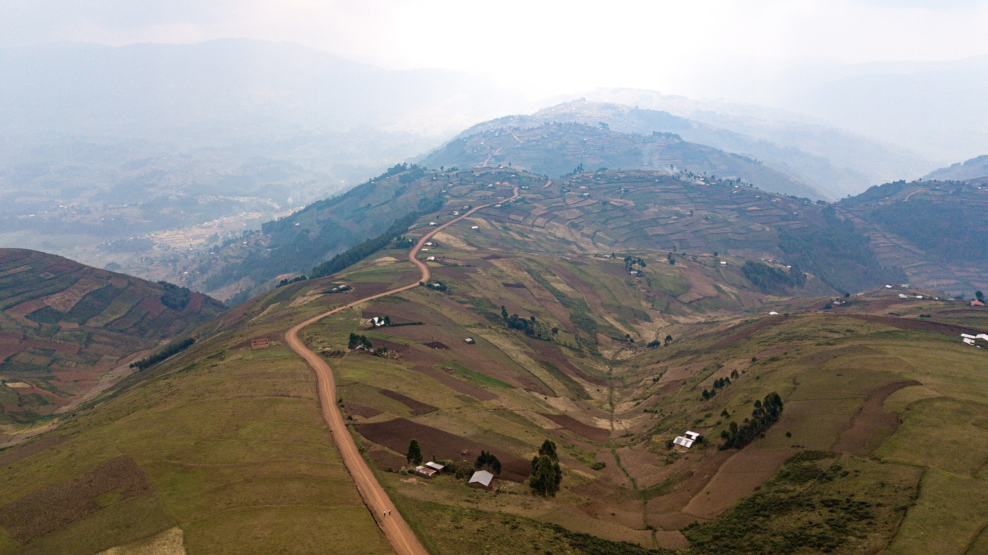 An aerial view of the hilltops and rural roads in Uganda.