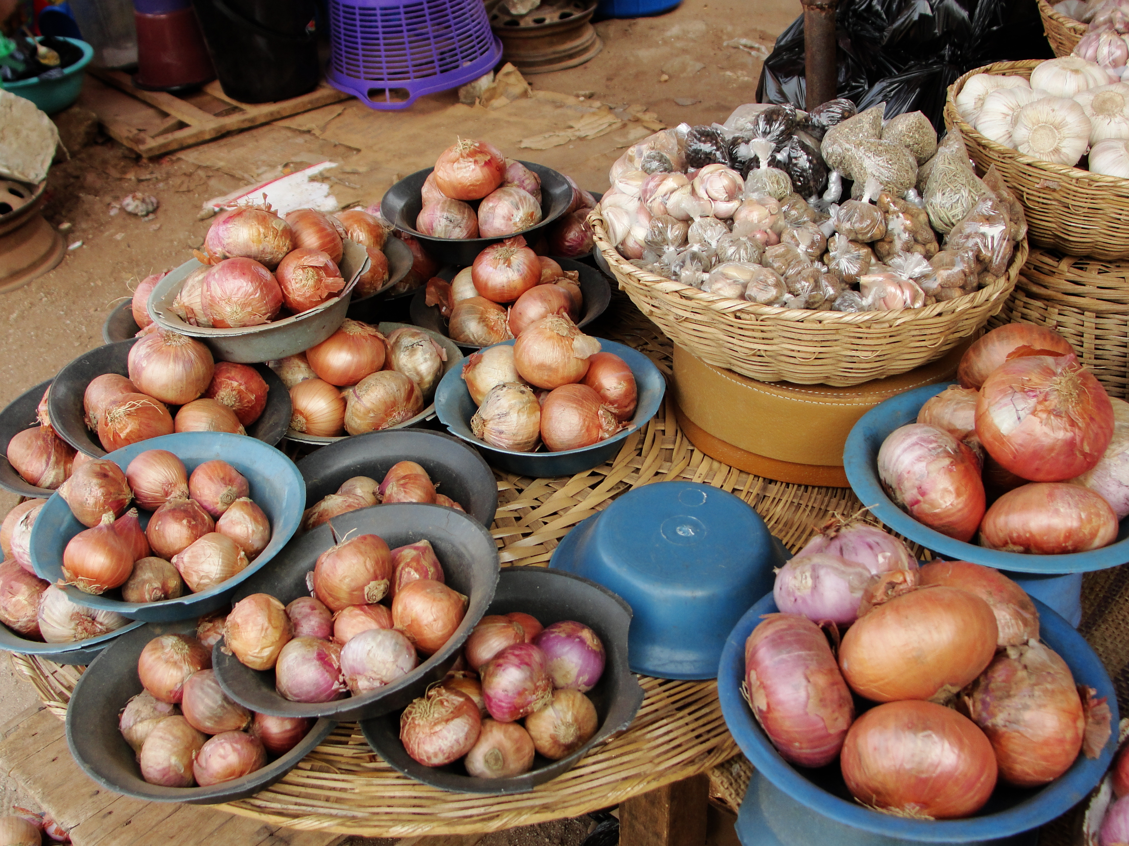 Fresh onions are sold at a local market.