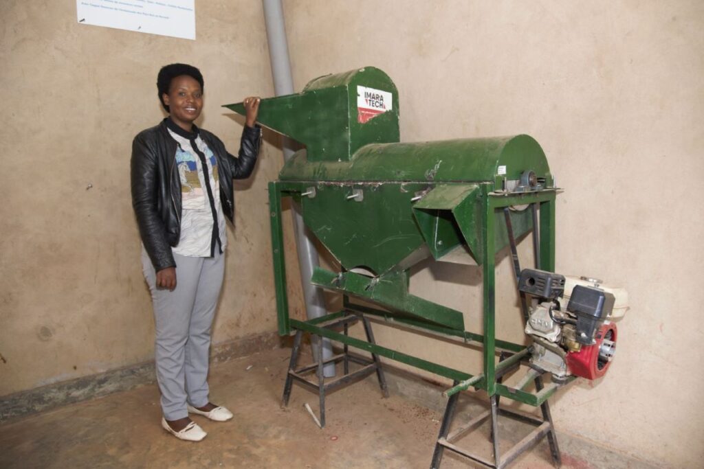 Anitha next to the destemmer for the Tubehoneza cooperative.