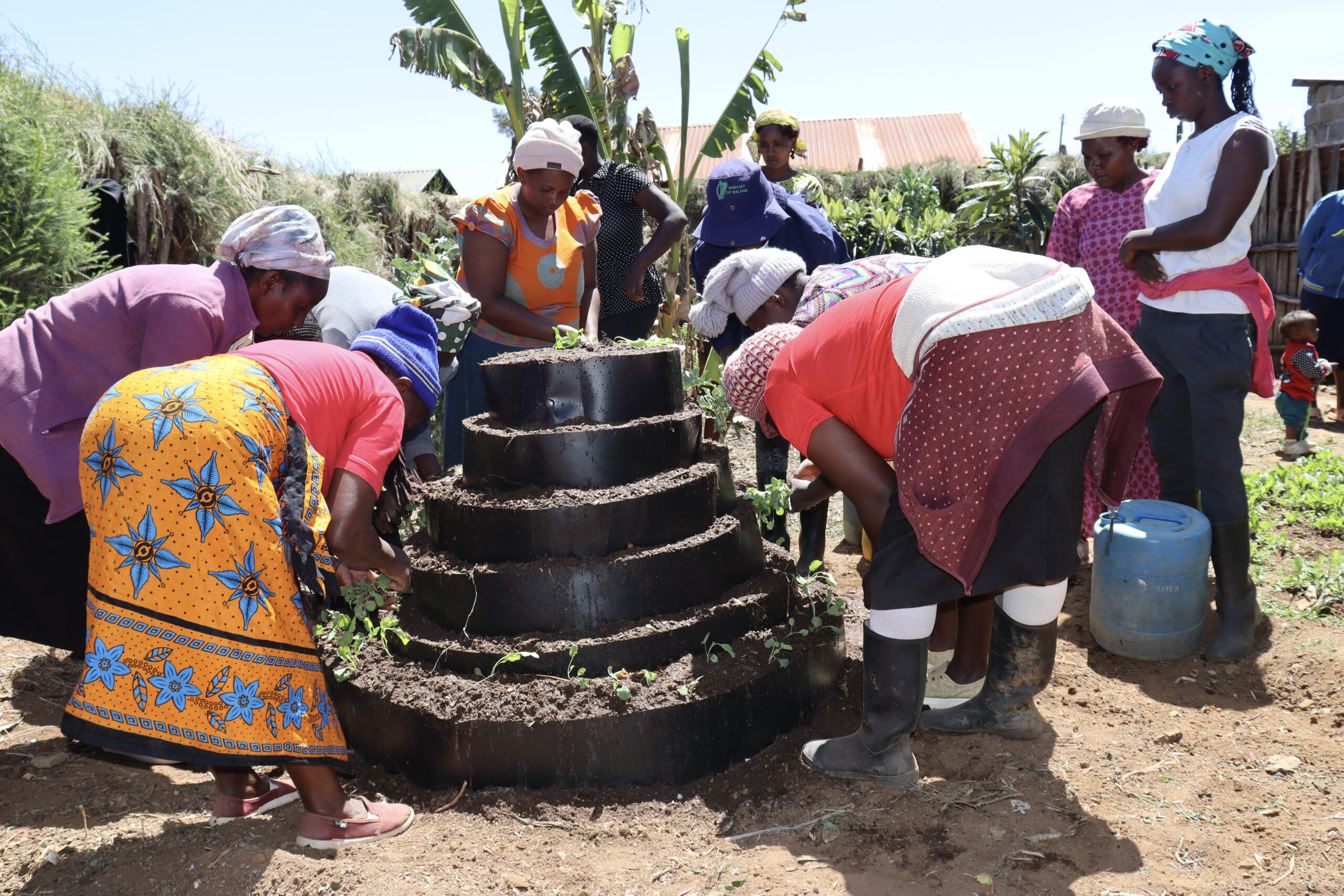 PCB members during a kitchen garden construction demonstration.