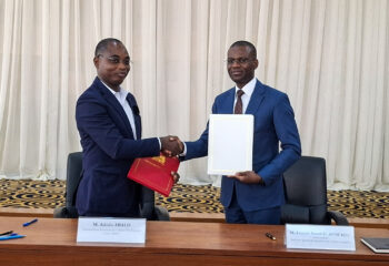 Adodo Abalo, IFDC Country Director in Benin, and His Excellency Franck Armel Afoukou, Secretary General of the Ministry of Foreign Affairs shake hands after signing the renewed Memorandum of Agreement.