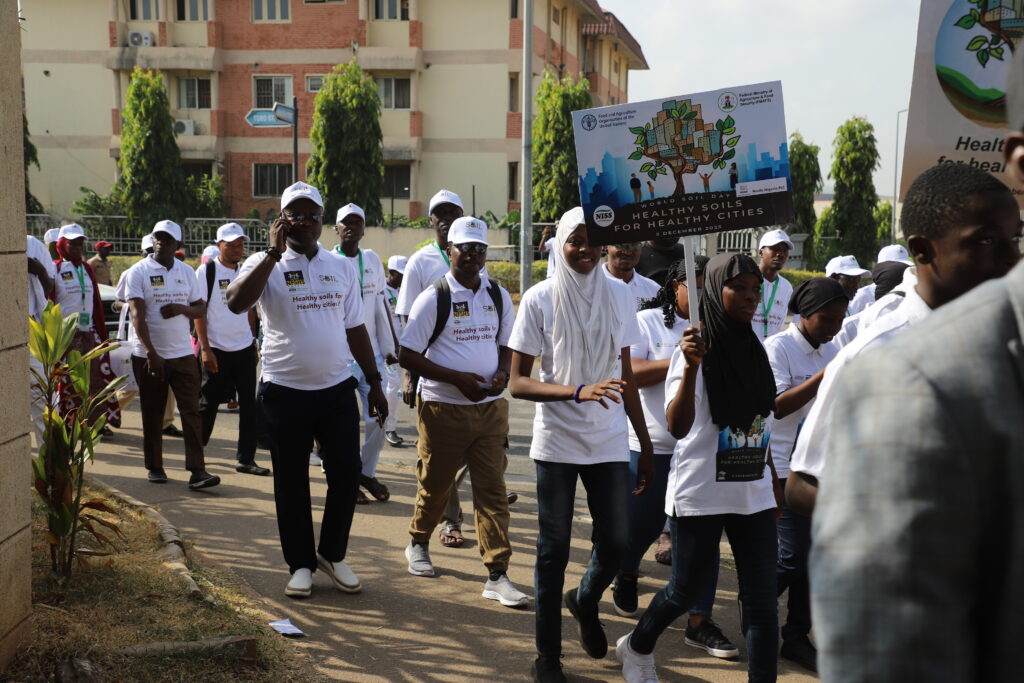 A group of staff members walking through the city.