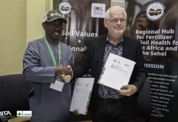 Alain Sy Traoré, Program Director of the Soil Values Program, and Dr. Bernard Vanlauwe, Deputy Director General for Research for Development (R4D) at IITA, sign the MoU.