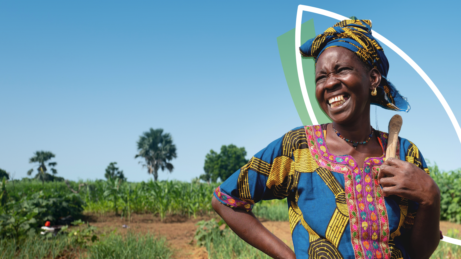 A women smiles in a field.