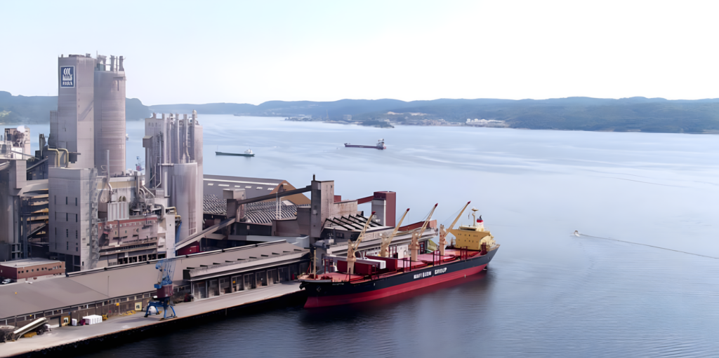 Cargo ship docked beside an industrial port. Source: Yara International
