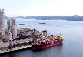 Cargo ship docked beside an industrial port. Source: Yara International