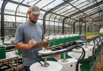 Researchers at IFDC measure greenhouse gas emissions using specialized equipment in greenhouse facilities at its headquarters in Muscle Shoals, AL.