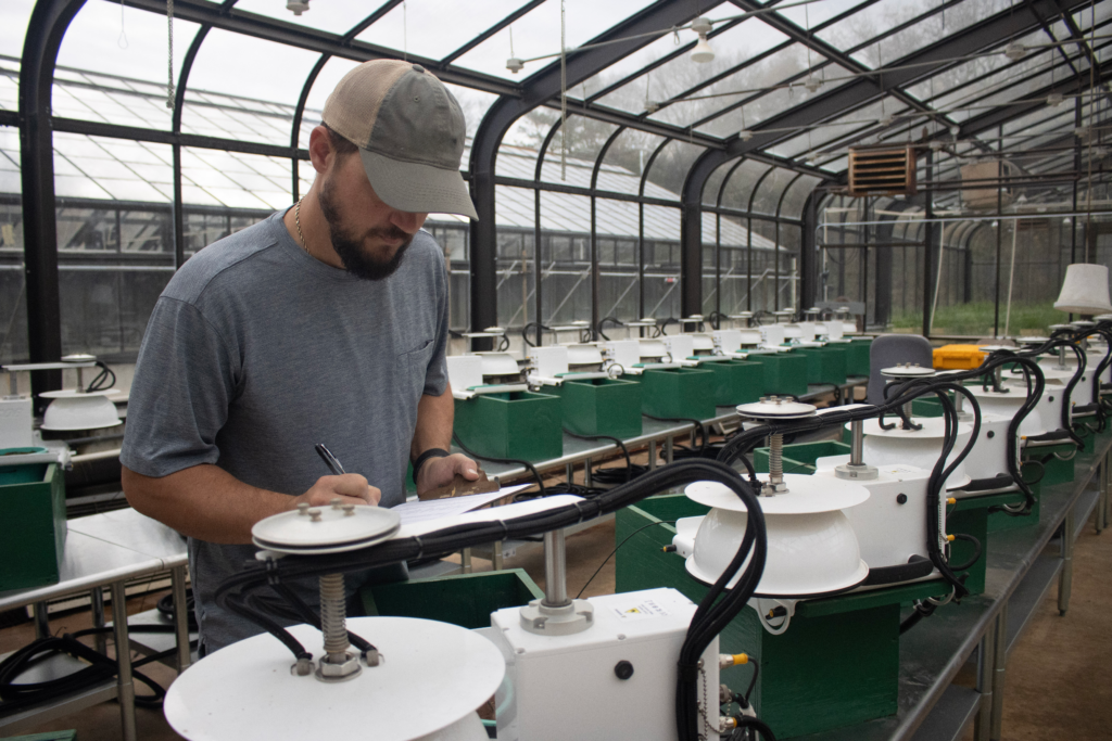 Researchers at IFDC measure greenhouse gas emissions using specialized equipment in greenhouse facilities at its headquarters in Muscle Shoals, AL.