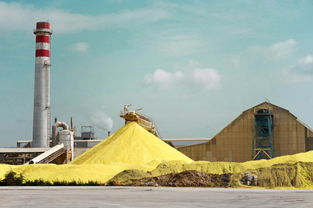 A pile of sulfur outside a factory.