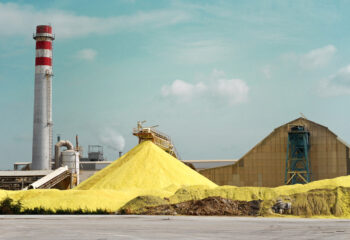 A pile of sulfur outside a factory.